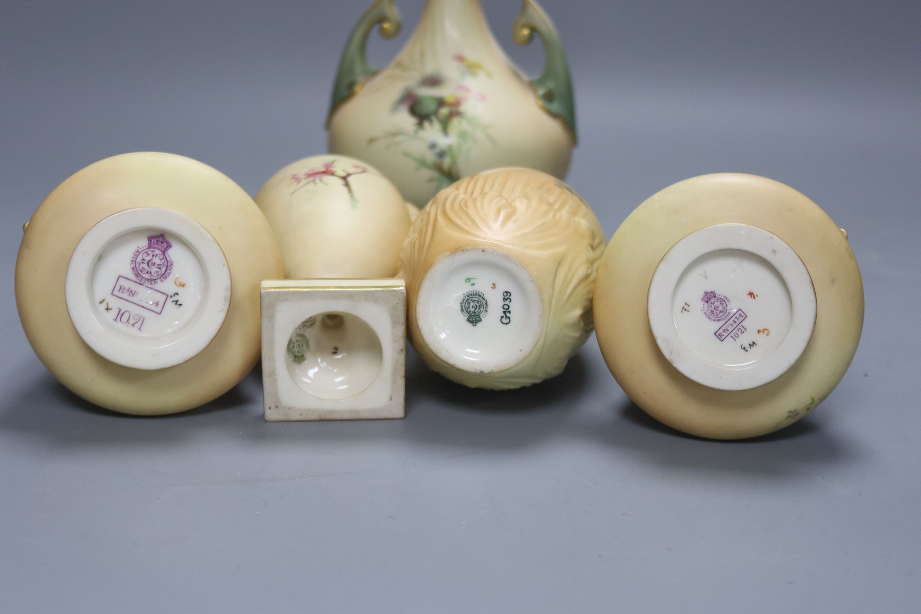 A group of Royal Worcester blush ivory - a pair of vases, and three other vases, 25cm
